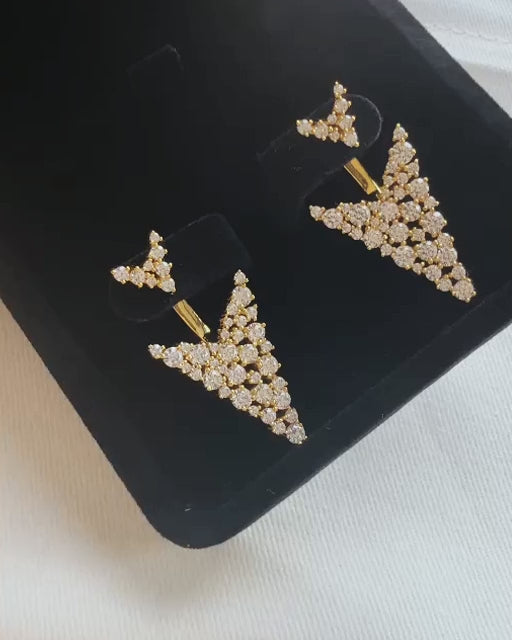 Melissa Gold earrings — close-up in black velvet box